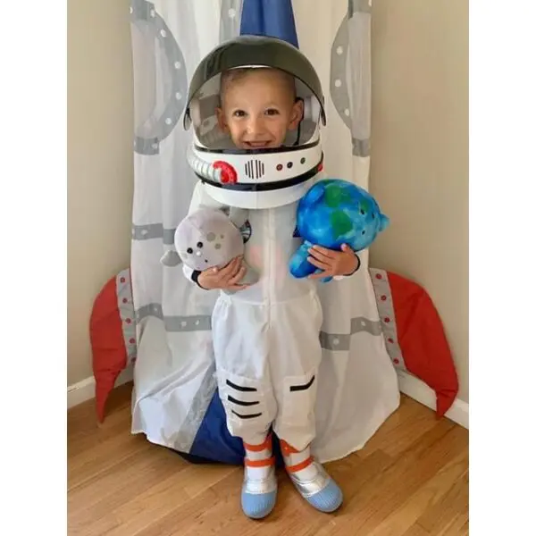 Kid playing with Moon and Earth Buddy